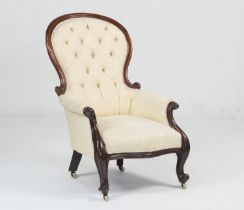 Victorian mahogany and cream coloured deep buttoned fabric upholstered spoonback armchair, circa