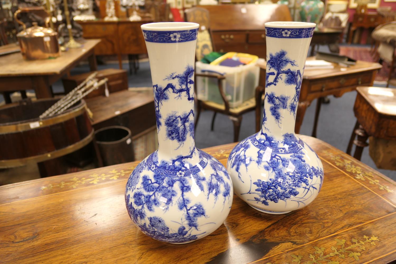 Pair of Japanese blue and white bottle vases, Taisho (1912-26), decorated with peony, fir and - Image 3 of 6