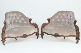 Pair of Victorian walnut and upholstered conversation seats, circa 1860, deep buttoned taupe