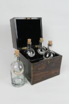 Victorian coromandel decanter box, with brass edging, opening to reveal four later clear glass