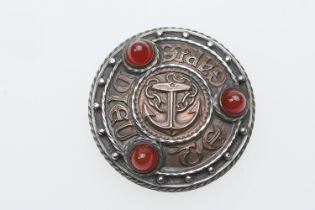 Omar Ramsden silver and copper brooch, circular form centred with an anchor and worked in Celtic