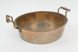 Heavy brass and copper braising pan, 19th Century, with twin carrying handles, 32cm diameter (Please