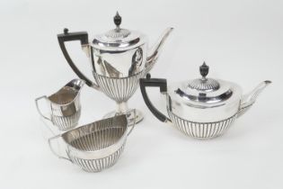 Silver composite four piece tea and coffee service, comprising teapot, sugar basin and milk jug by