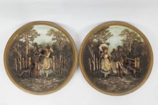 Pair of Bavarian terracotta bas relief wall plaques featuring a hunter's encounter, decorated in
