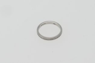 Platinum and diamond eternity ring, channel set with tiny round cut diamonds, marked '950', size