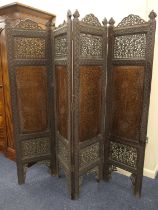 Indian carved hardwood and brass inlaid panelled four fold dressing screen, circa 1900, height