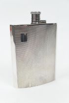 Silver hip flask, Birmingham 1989, of curved form with bayonet hinged cap, engine turned