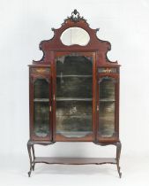 Late Victorian mahogany mirrored back display cabinet, circa 1890, having a kidney shaped bevelled