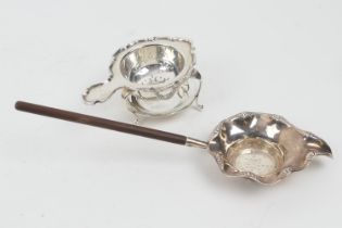 Sterling silver tea strainer, with wooden handle, import marks, 21cm; also another silver tea