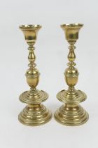 Pair of Benham & Froud brass candlesticks in the Dutch style, height 27cm (Please note condition