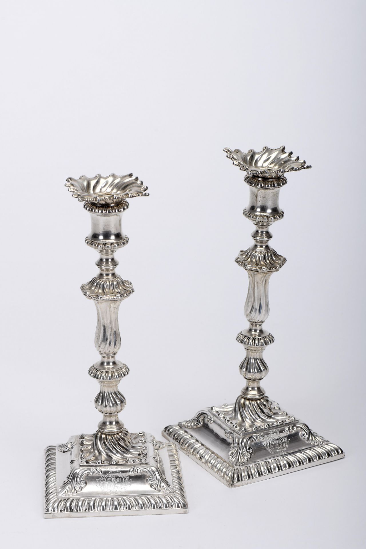 A pair of square base candlesticks