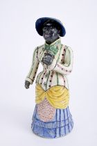 A large covered bottle "African woman wearing a hat and holding a book"