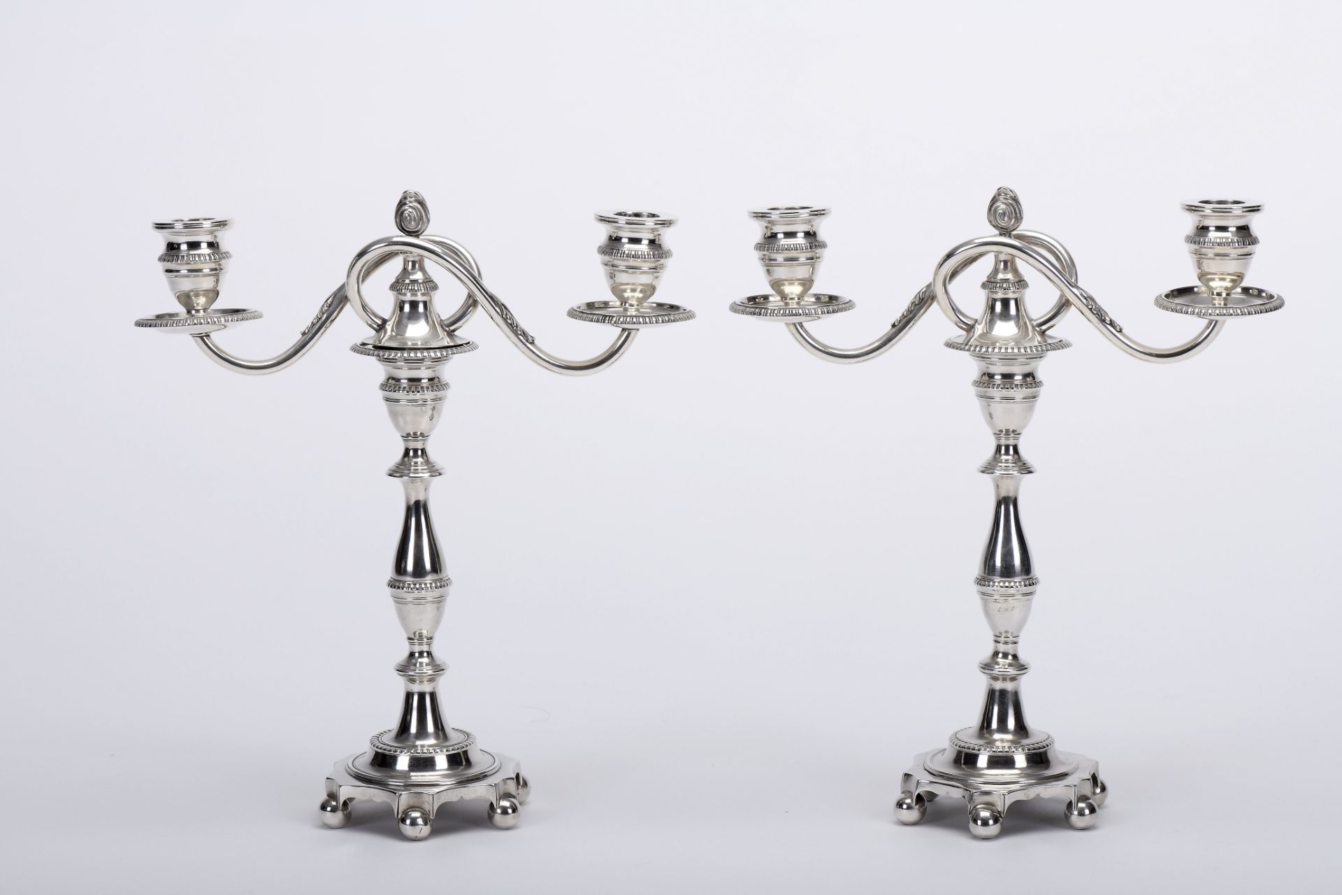 A pair of candlesticks with two-light serpentines