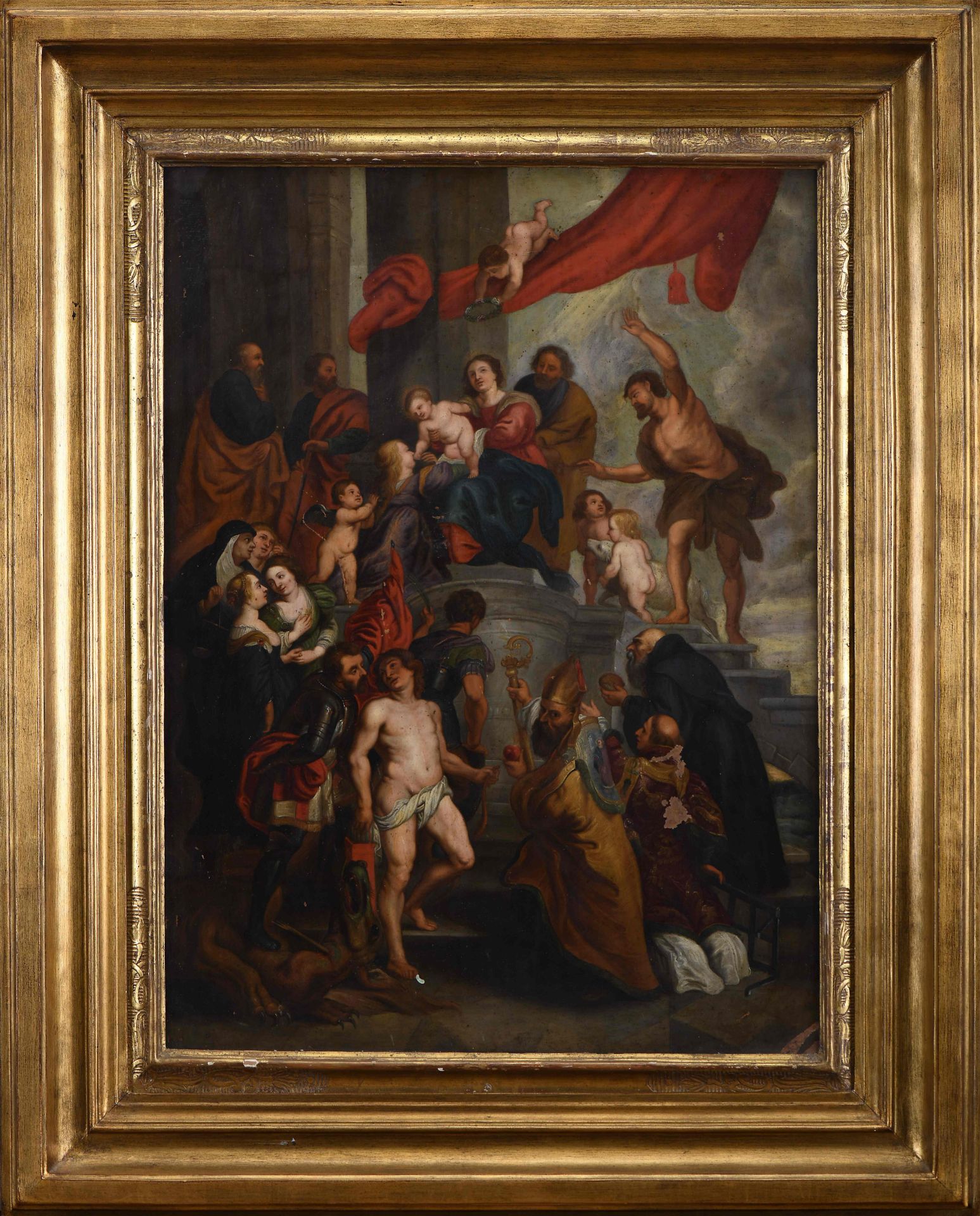 Our Lady holding the Child Jesus surrounded by several Saints