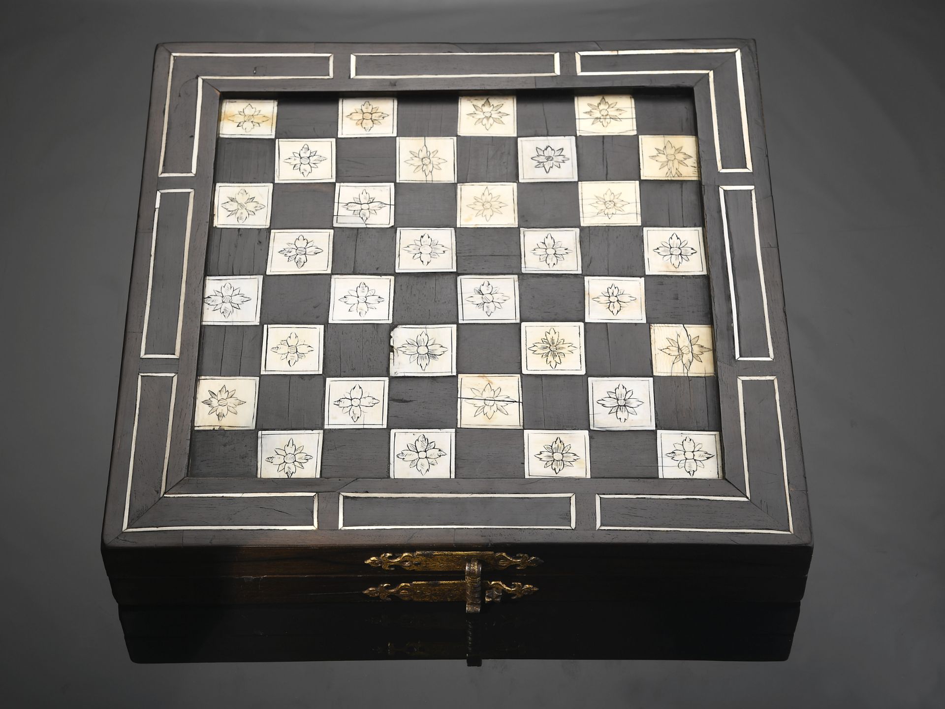 Chess, Backgammon and Nine Men’s Morris (Mill game) board articulated and closing in the shape of a 