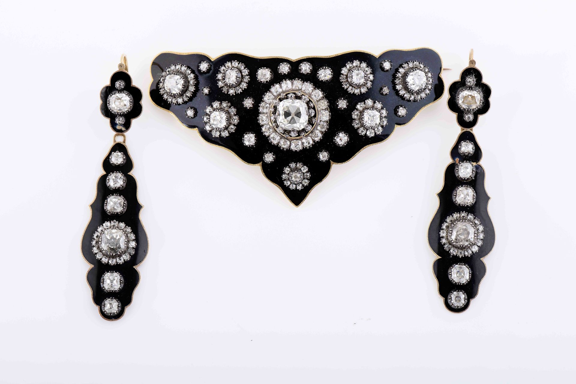 A demi-parure - brooch and pair of earrings