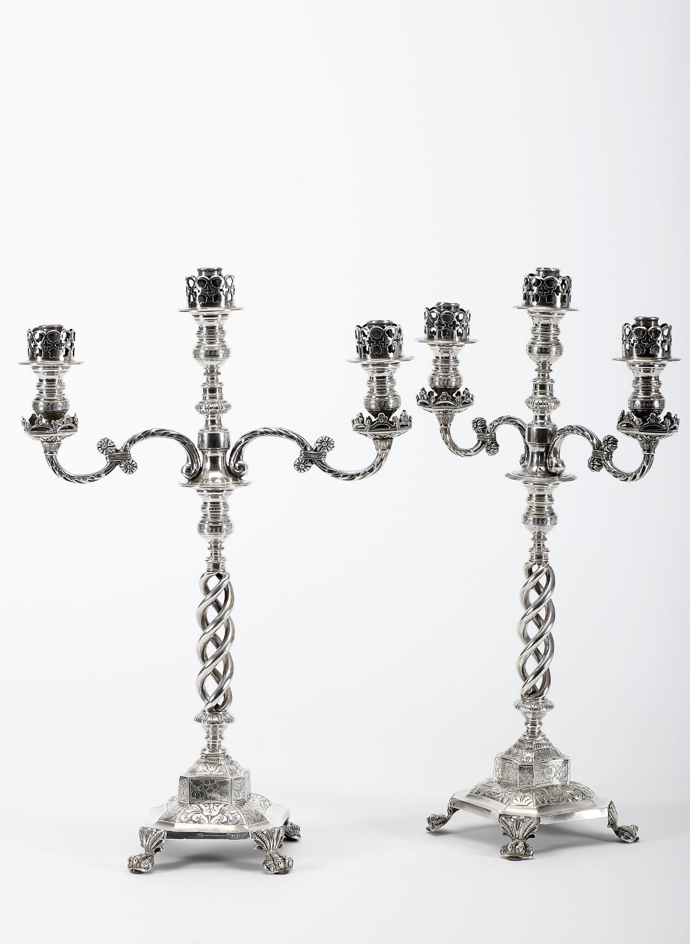 A pair of four-foot candlesticks with three-light serpentines