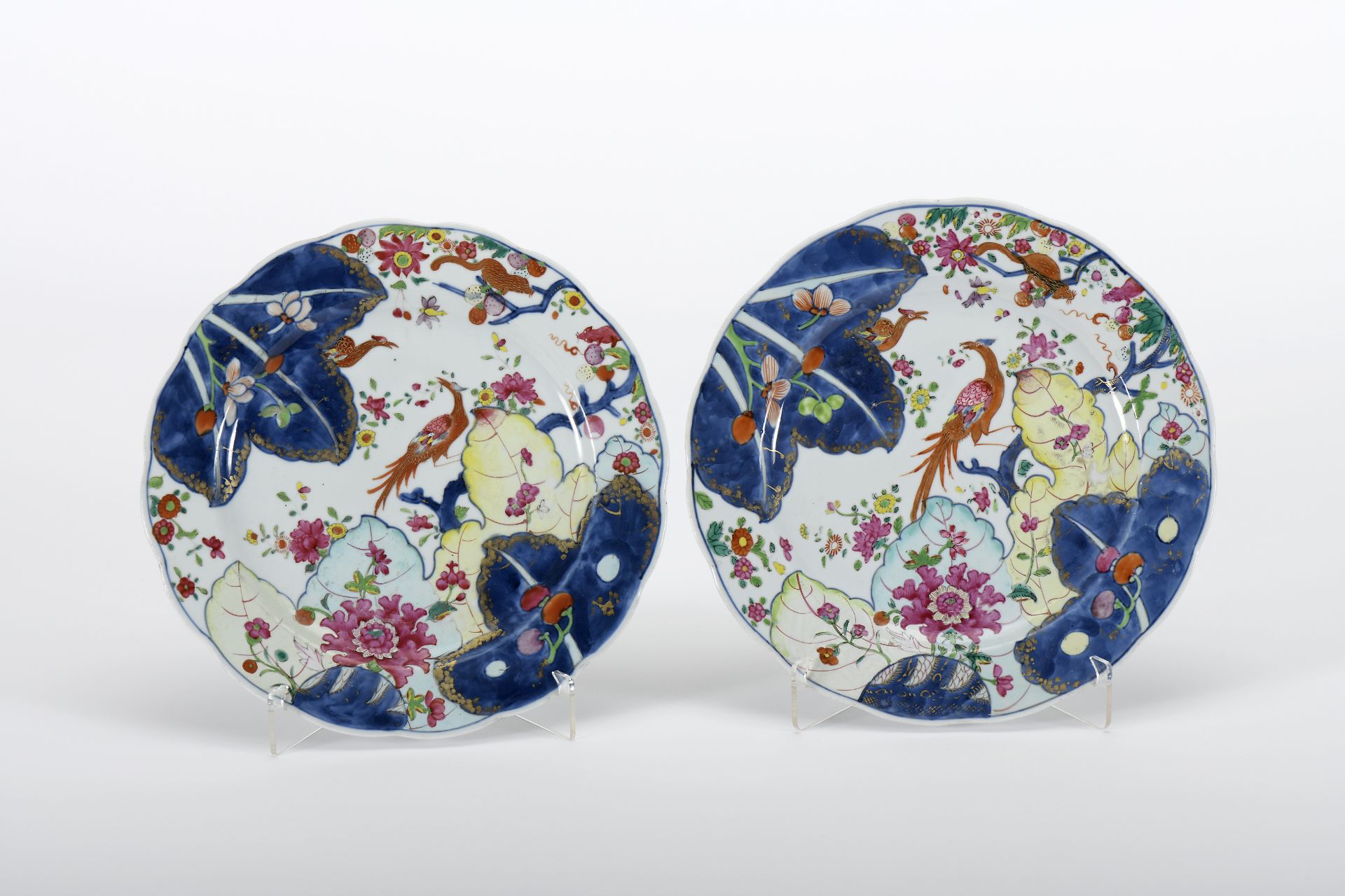 A pair of large scalloped plates