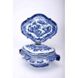 A scalloped tureen with stand
