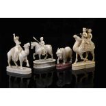 Chess Pieces - Two on a camel, one on horseback and a bull