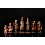 Seven chess pieces - red pawns