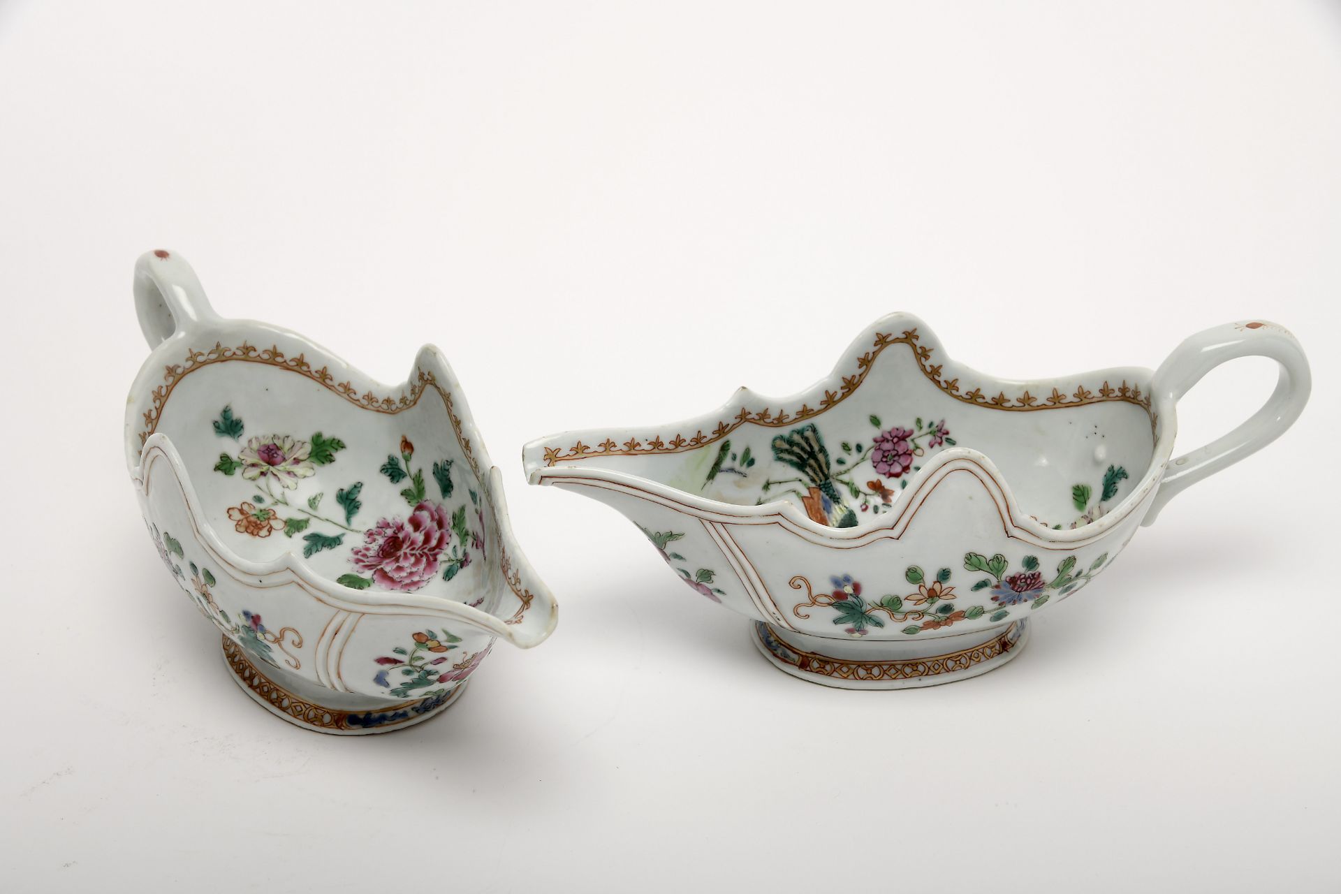 A pair of scalloped sauce boats