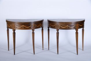 A pair of demi-lune gaming tables