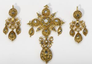 A "Cross" pendant and a pair of earrings