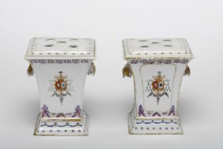 A pair of jardinieres with grilles