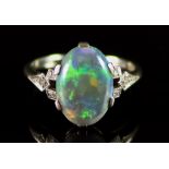 An 18ct White Gold and Platinum Opal Cabochon Ring, 20th Century, set with a centre opal stone, 13mm