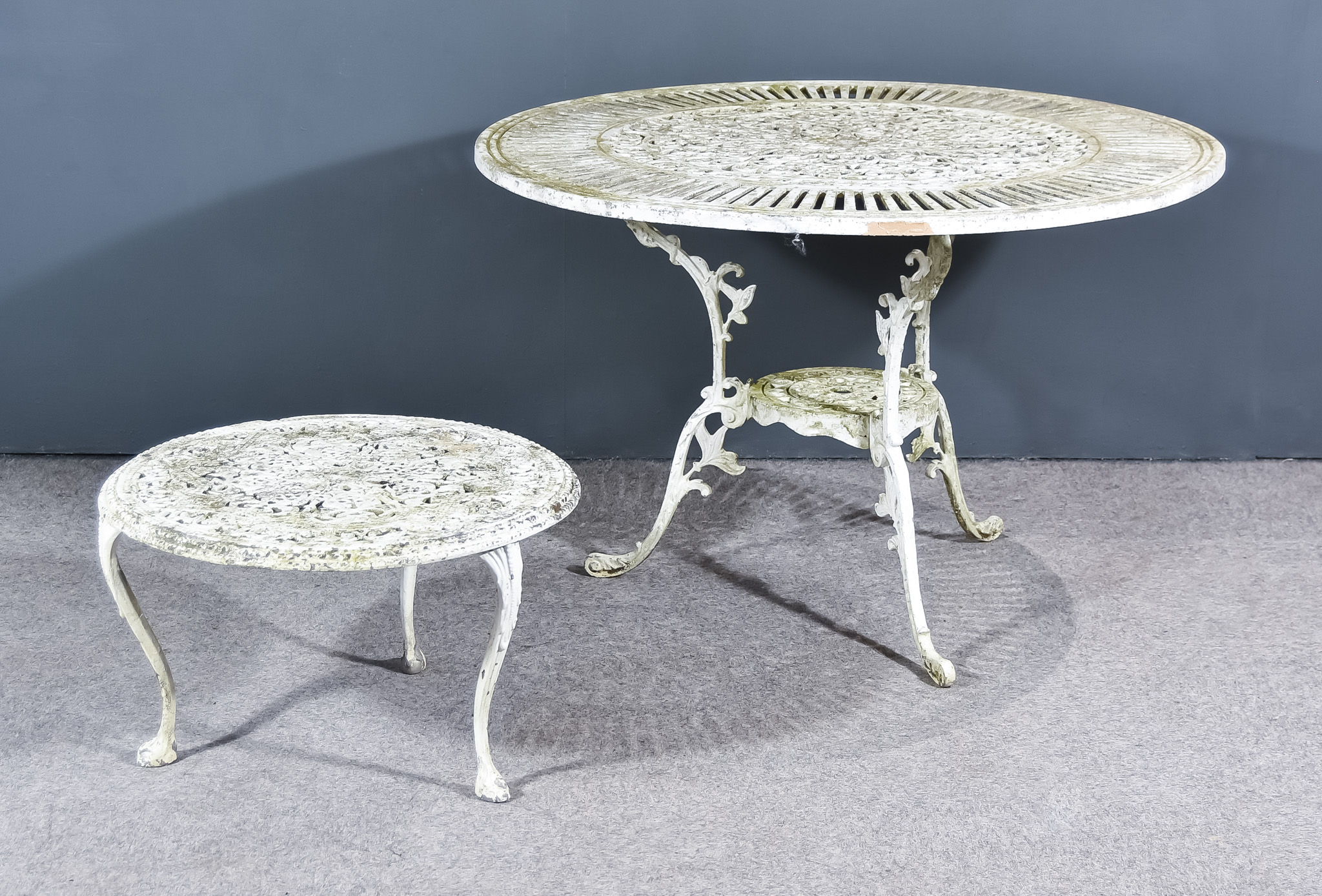 A White Painted Aluminium Garden Table, the top cast with trailing leaf and floral ornament,