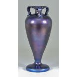 A Continental Metallic Bronze Glatt Iridescent Three-Handled Glass Vase, with purple and blue