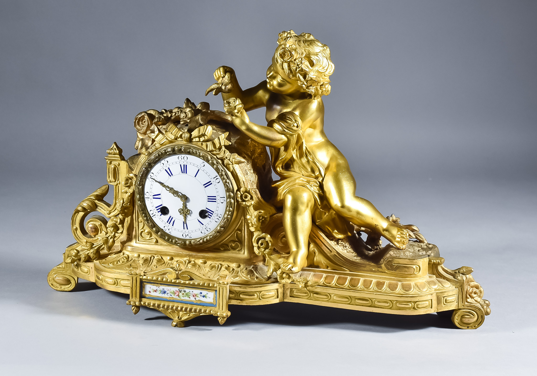 A 19th Century French Guilt Metal Cased Mantel Clock by Henri Marc of Paris, the 3ins diameter white