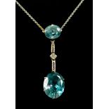 A 9ct White Gold Blue Topaz Drop Pendant, 20th Century, set with two blue topaz stones interspaced