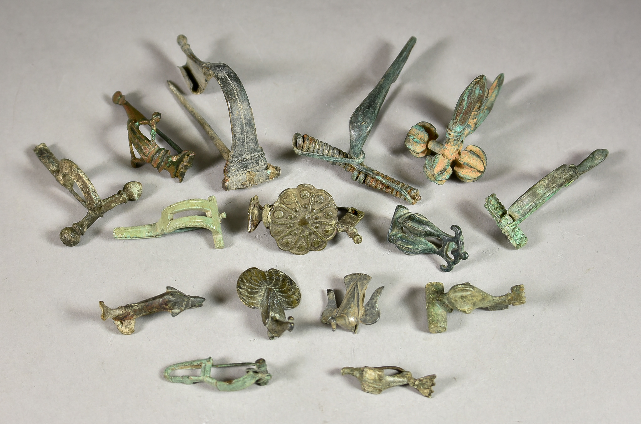 A Collection of Primarily Roman Bronze Fibulae, and other brooch forms Provenance: A deceased estate