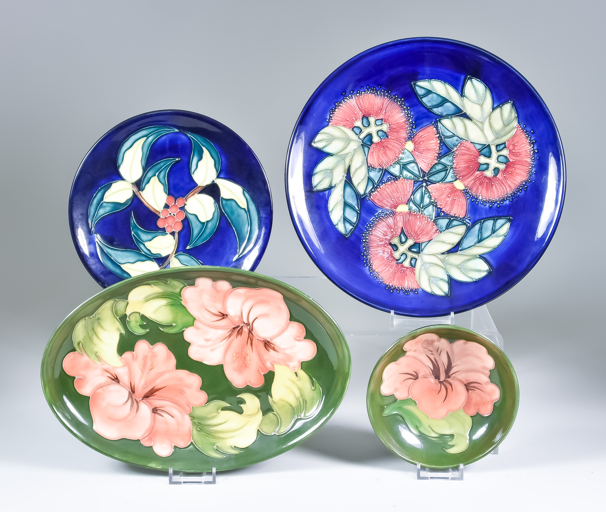 A Selection of Moorcroft Pottery, including a circular plate, decorated in Berries and Leaf