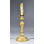 A 19th Century French Gilt Metal Candlestick of Louis XVI Design with bead mounts, cast and chased