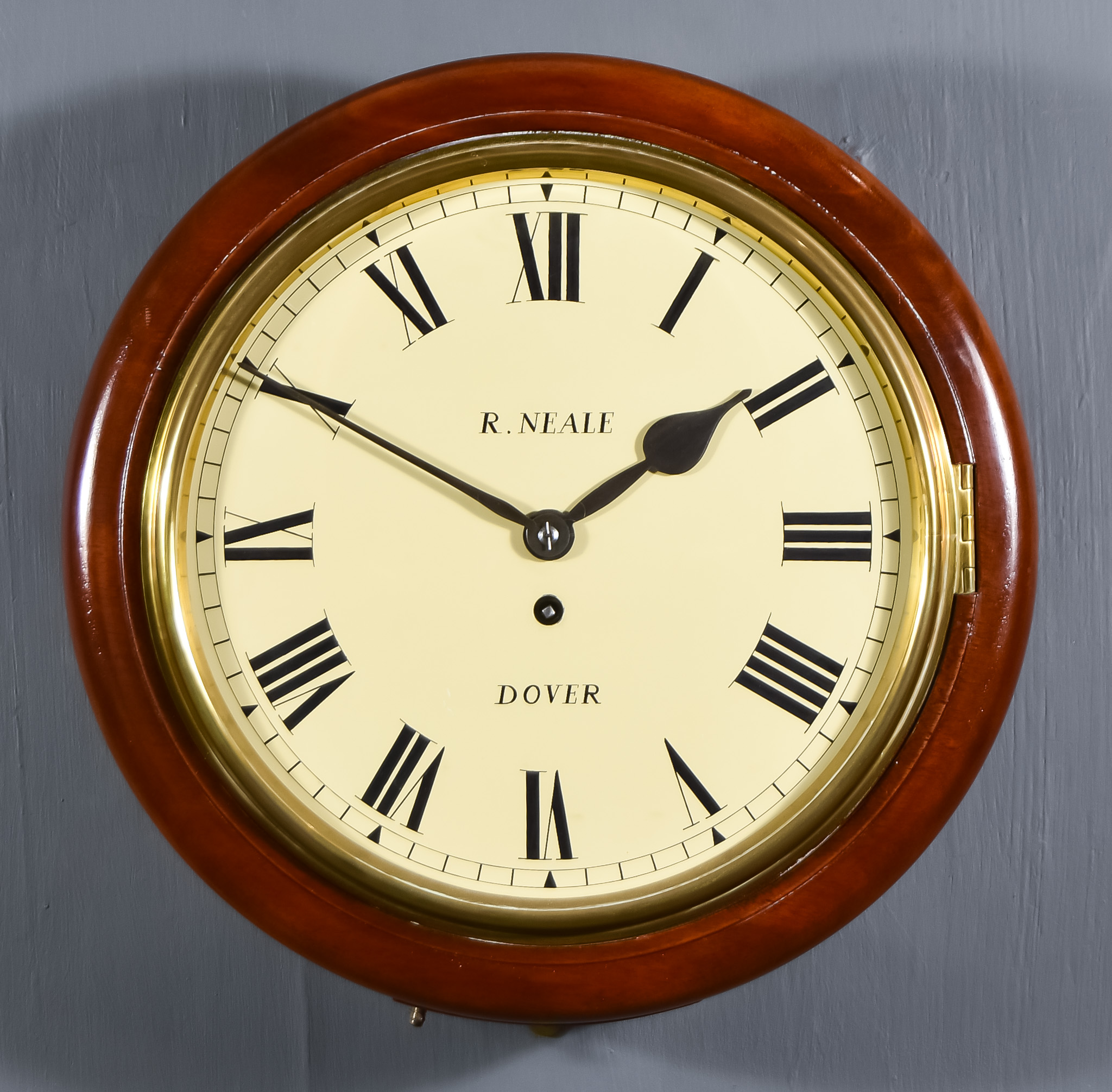 A 19th Century Mahogany Cased Dial Wall Clock by R Neale of Dover, the 12ins cream metal dial with