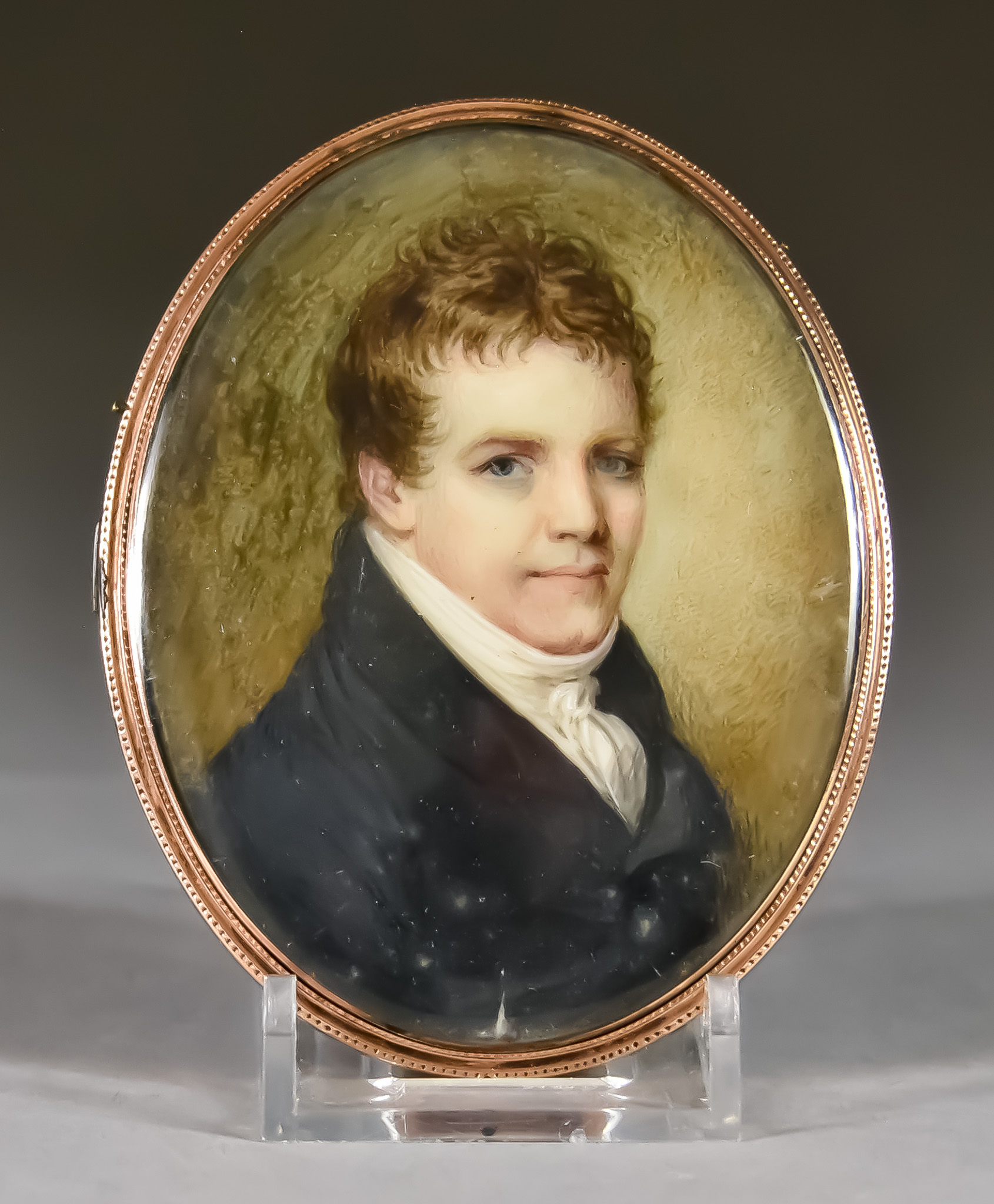 Early 19th Century English School - Shoulder length miniature of a gentleman wearing a blue coat and