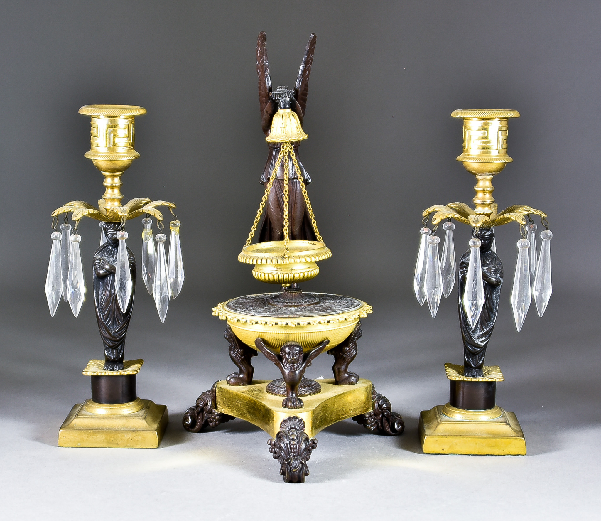 A French Bronze and Gilt Pastille Burner, 19th Century, with standing winged figure on triangular