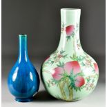 A Chinese Porcelain Bottle-Shaped Vase, Modern, enamelled with peaches and flowering branches, on