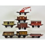 A Quantity of Hornby "O" Gauge Tin Plate Wagons and Engines, including - twelve open goods wagons (