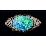 A Opal Brooch, 20th Century, silver base with 9ct gold leaf design to the front set with a large