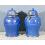 A Pair of Chinese Blue Glazed Porcelain Baluster-Shaped Vases and Covers, with oxidised metal hasp