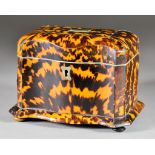 A Tortoiseshell Two-Division Tea Caddy, 19th Century, with serpentine front, white metal cartouche