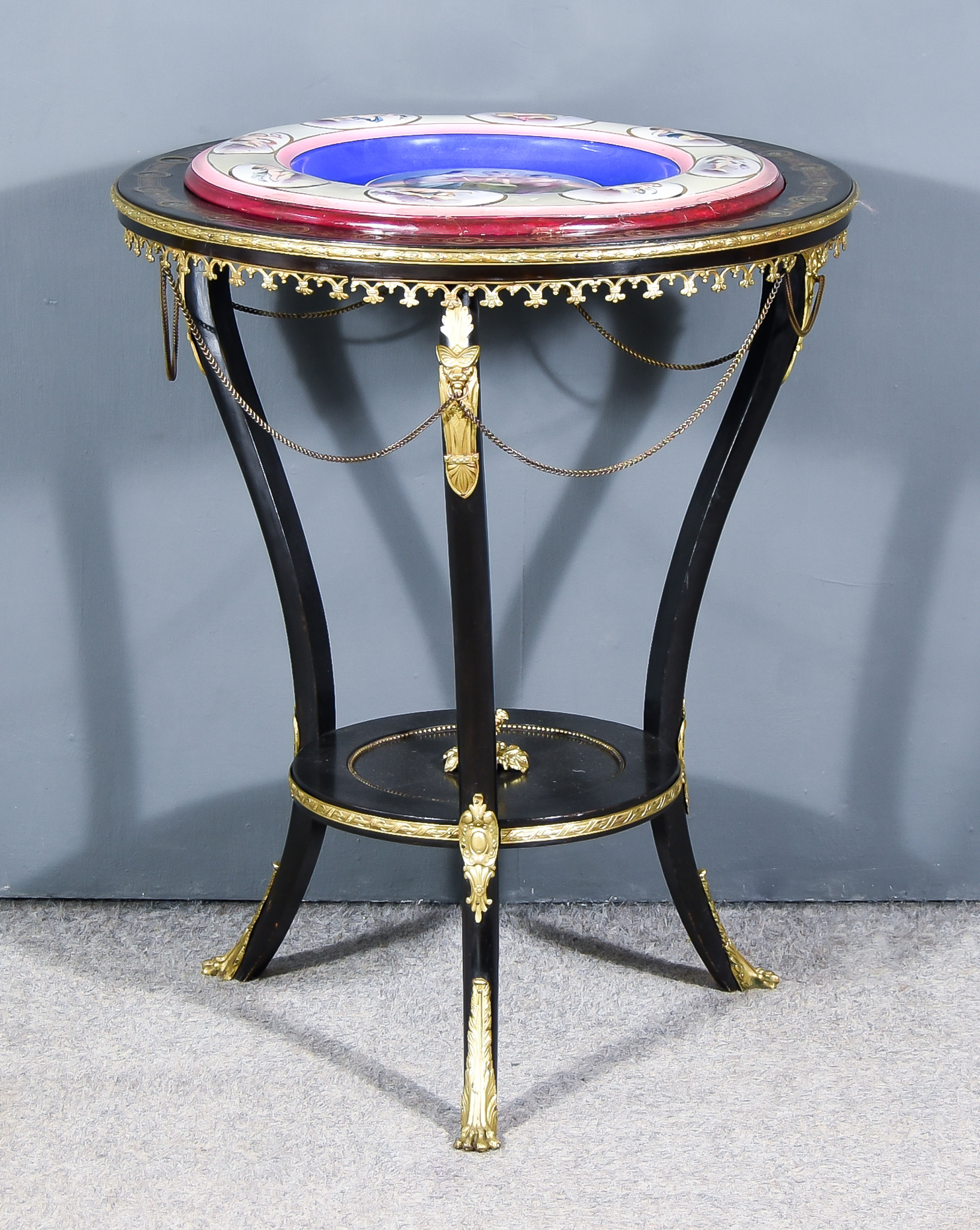 A 19th Century Continental Ebonised, Rosewood and Brass Mounted Two-Tier Centre Table, the top