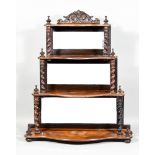 A 19th Century Four-Tier Mahogany Wall Shelf of Serpentine Outline, each tier with turned finials