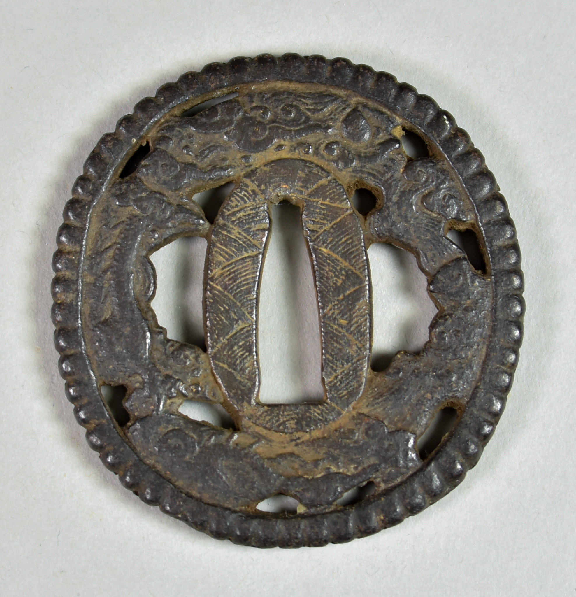 A Japanese Tsuba, iron Hizen School, Naga Maru-gata depicting dragon, clouds and waves, Edo - Image 2 of 2