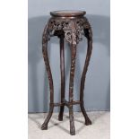 A Chinese Carved Hardwood Circular Jardiniere Stand, the top inset with red veined marble, and