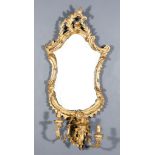 A 19th Century Gilt Framed Girandole of Rococo Design, the cartouche-shaped frame moulded and carved